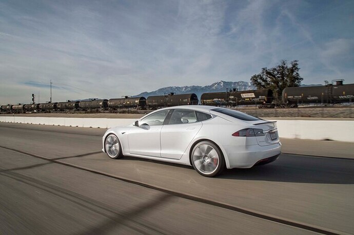 2017-Tesla-Model-S-P100D-rear-three-quarter-in-motion-03